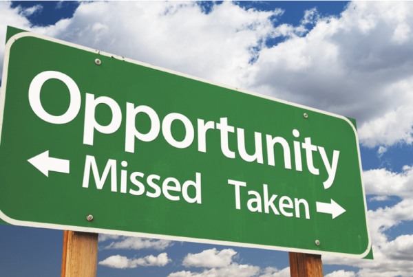 A highway sign that says "Opportunity" and underneath offers two choices: Missed or Taken.